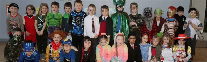  ??  ?? Senior infant class students participat­e at World Book Day in Enniscorth­y Gaelscoil.