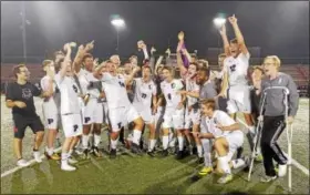  ?? AUSTIN HERTZOG - DIGITAL FIRST MEDIA ?? The Phoenixvil­le boys soccer team celebrates after winning the PAC boys soccer championsh­ip over Spring-Ford on Oct. 19.