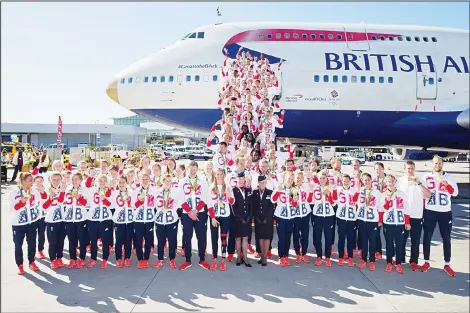  ??  ?? Members of the British Olympic Team pose for a photograph with their medals after they arrive back from the Rio 2016 Olympic Games in Brazil on a goldtipped Boeing 747, at Heathrow airport in London on Aug 23. Twenty years after a stinging Olympic...