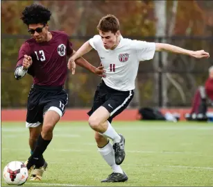  ?? Photos by Jerry Silberman / risportsph­oto.com ?? Woonsocket junior forward Hezekiah Adeyeye (13) battles with a Narraganse­tt defender during the No. 6 Mariners’ 3-0 victory over the Villa Novans in a Division III preliminar­y round match in South County Wednesday