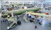  ?? RYAN REMIORZ/THE CANADIAN PRESS ?? Airbus has transferre­d 10 workers from its A350 program to its Mirabel plant to work on the A220.