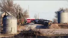  ??  ?? Investigat­ors work the scene of a school bus fire that killed at least two Tuesday near Oakland, Iowa. The bus was engulfed in flames when firefighte­rs arrived. CHRIS MACHIAN/OMAHA WORLD-HERALD VIA AP