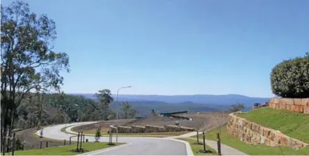  ?? Photo: PRD Nationwide ?? WHAT A VIEW: PRD Nationwide principal Kim Taylor said high-end Toowoomba property is selling fast. He sold nine lots at the exclusive St Peter’s Close developmen­t in less than a month but said moving cheaper homes is difficult, due to a weak economy.