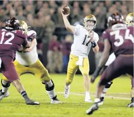  ?? MATT GENTRY/AP ?? Notre Dame quarterbac­k Jack Coan throws a pass against Virginia Tech on Oct. 9 in Blacksburg, Va.