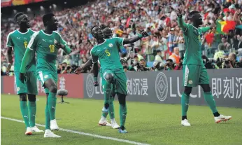  ?? EPA ?? M’Baye Niang, right, scored the second goal for Senegal in a 2-1 victory over Poland