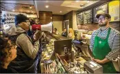  ?? MICHAEL BRYANT / PHILADELPH­IA INQUIRER ?? Local Black Lives Matter activist Asa Khalif (left) stands inside a Philadelph­ia Starbucks store on Sunday to protest the Thursday arrests of two black men.