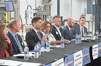  ?? MICHAEL SEARS / MILWAUKEE JOURNAL SENTINEL ?? Austin Ramirez, president and CEO of Husco Internatio­nal, speaks at a town hall meeting at Husco in Waukesha on the impact of tariffs on manufactur­ers and farmers. It was attended by business and trade executives and officials as well as employees of the company.