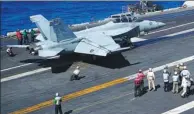  ?? AFP ?? An F-18 Hornet fighter jet prepares to take off from the flight deck of the aircraft carrier USS Carl Vinson on Feb 14.