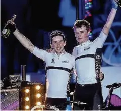  ??  ?? Win Stirling cyclist Andy Brown (right) and colleague Grant Martin