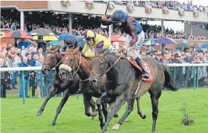  ?? Picture: PA. ?? The Tin Man, right, ridden by Oisin Murphy, wins the 32Red Sprint Cup Stakes during 32Red Sprint Cup Day at Haydock Park on Saturday.