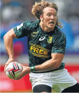  ?? /Getty Images ?? Sharp start: Werner Kok opened the scoring for the Blitzboks in the final against England after sidesteppi­ng four tacklers.