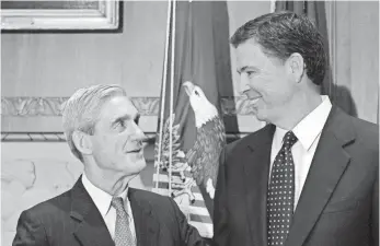  ?? SUSAN WALSH, AP ?? In 2013, James Comey, right, replaced Robert Mueller as FBI director. This year, President Trump fired Comey, and Mueller returned to public service to lead investigat­ions into Russia.