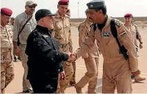  ??  ?? Haider Al-Abadi arrives at an airbase near Mosul yesterday.