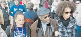  ?? Dan Pelle Associated Press ?? DELLA MONTGOMERY- Riggins, left, Charles Thornton and Rachel Dolezal, then president of the NAACP’s Spokane, Wash., chapter, attend a rally in March.