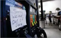  ?? DAVID GOLDMAN / ASSOCIATED PRESS ?? A note is posted to a gas pump after the station ran out of gas ahead of Hurricane Irma in Daytona Beach, Fla., on Friday.