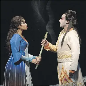  ?? RICHARD TERMINE/METROPOLIT­AN OPERA ?? Golda Schultz, left, is Pamina and Charles Castronovo is Tamino in this season’s production of Mozart’s The Magic Flute at the Metropolit­an Opera in New York.