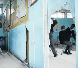  ??  ?? A hole in the wall is linking two classroom at the Soweto primary school that has fallen into disrepair.