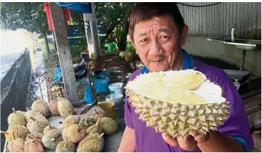  ??  ?? Normal now: Tan is delighted to run his business without air pollution from the illegal carbon factory in Kampung Sungai Lembu.