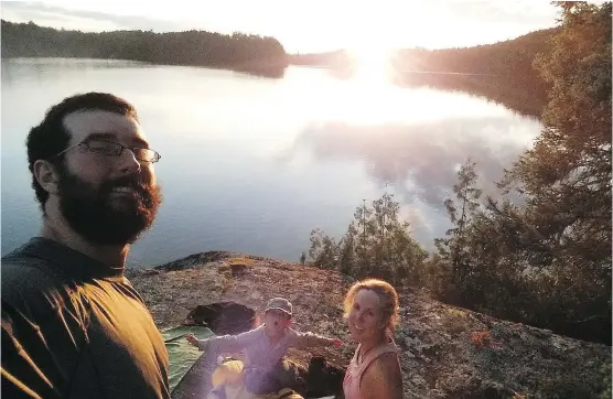  ?? PHOTOS: FOR POSTMEDIA NEWS ?? Benoit Gendreau-Berthiaume, Magali Moffatt and their son, Mali, camp on Lake Kakagi, in Western Ontario this summer. The family just completed an almost five-month, 5,000-kilometre crosscount­ry canoe trip from Edmonton to Montreal in part to encourage...