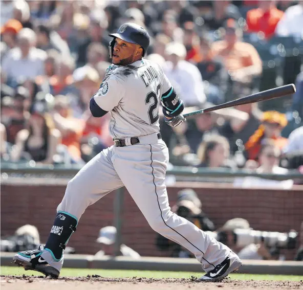  ?? — GETTY IMAGES ?? Seattle Mariners slugger Robinson Cano hit an RBI double in the fifth inning against the San Francisco Giants at AT&T Park in San Francisco Tuesday as the visitors defeated the Giants in their home opener with a 6-4 victory in front of a crowd of 40,901.