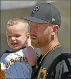  ?? Matt Freed/Post-Gazette ?? Todd Frazier holds his son, Grant, 2, as he waits for the rest of his family after a recent exhibition game at LECOM Park in Bradenton, Fla.