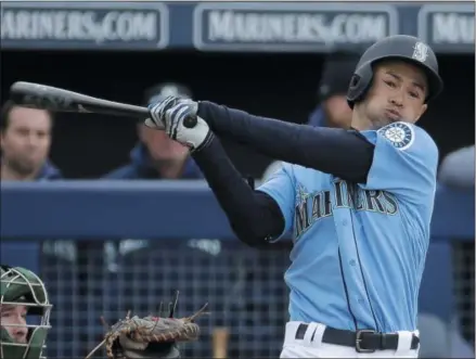  ?? CHARLIE RIEDEL ?? FILE - In this Friday, Feb. 22, 2019file photo, Seattle Mariners’ Ichiro Suzuki bats during the third inning of a spring training baseball game against the Oakland Athletics in Peoria, Ariz. Jerry Dipoto’s first introducti­on to the world of Ichiro Suzuki was only a small taste compared to what the Seattle Mariners are about to experience when they open the season in Tokyo with a pair of games against the Oakland Athletics. The most decorated player ever to export his talents from Japan to the major leagues is returning home for what could be a farewell to his Hall of Fame career on both sides of the Pacific. His teammates can’t wait.