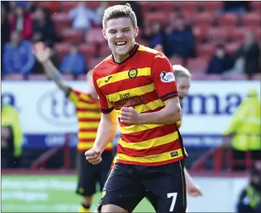  ??  ?? Blair Spittal celebrates getting Thistle back on level terms before going on to net the winner against Queen of the South