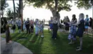  ?? JENNIFER MCDERMOTT — THE ASSOCIATED PRESS ?? This photo shows a hula lesson at a traditiona­l hula and feast, the Old Lahaina Luau, in Maui.