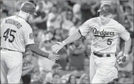  ?? Robert Gauthier Los Angeles Times ?? DODGERS shortstop Corey Seager, right, is rehabbing in L.A. after two surgeries.