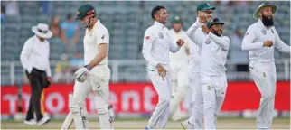  ?? – Reuters ?? IN DOMINANT POSITION: South Africa’s Keshav Maharaj celebrates with his team mates after dismissing Australia’s Shaun Marsh at The Wanderers in Johannesbu­rg on Saturday.