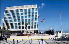  ?? ASSOCIATED PRESS ?? IN THIS PHOTO TAKEN Aug. 14, 2015, a U.S. flag flies at the U.S. embassy in Havana, Cuba. Two more American diplomats who served in Cuba are affected by health attacks in Cuba.