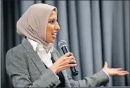  ??  ?? Melanie Elturk, chief executive officer of Haute Hijab, speaks during a “World Hijab Day”celebratio­n at the Aloft Hotel.