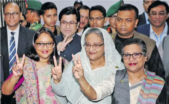  ??  ?? Prime Minister Sheikh Hasina (front row, middle), the 71-year-old leader is set for a record fourth term in office in the South Asian Muslim-majority nation of 160 million.