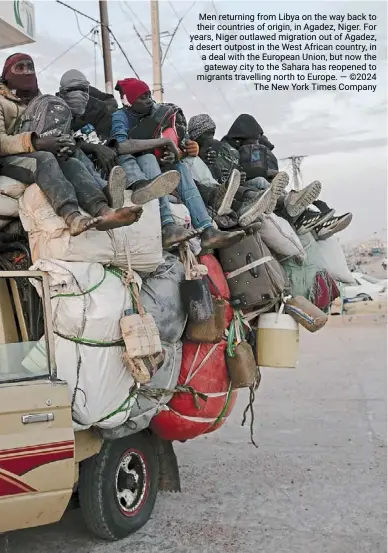  ?? — ©2024 The New york Times company ?? Men returning from Libya on the way back to their countries of origin, in agadez, Niger. For years, Niger outlawed migration out of agadez, a desert outpost in the West african country, in a deal with the European Union, but now the gateway city to the Sahara has reopened to migrants travelling north to Europe.