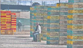  ??  ?? Hawkers sit idle at Gazipur chicken market which has been closed due to bird flu outbreak in New Delhi on Wednesday