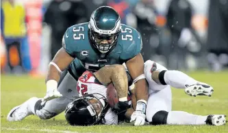  ?? PATRICK SMITH/GETTY IMAGES ?? Philadelph­ia Eagles’ linebacker Brandon Graham tackles Atlanta Falcons’ running back Devonta Freeman during the fourth quarter of their NFC Divisional playoff game on Saturday night. The Eagles won the game 15-10.