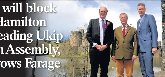  ??  ?? Nigel Farage on the Ukip campaign trail in Caerphilly yesterday with Mark Reckless, left, and Nathan Gill, right