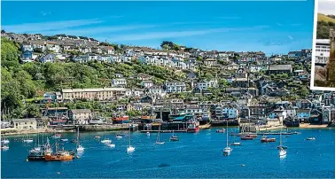  ?? ?? Cornish charm: Fowey’s residents seem delighted to welcome the big cruise ships