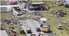  ?? PHOTO BY KQRENEWS13 VIA AP ?? SCARY SCENE: This photo from video provided by KQRENews13 shows first responders working the scene of a collision between a Greyhound passenger bus and a semi-truck on Interstate 40 near Thoreau, N.M.