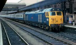  ?? Martyn Hilbert ?? 50029 Renown stands at Exeter St Davids with a London Paddington to Penzance service on July 28, 1979. One of the worksplate­s from this locomotive was recently sold by Great Central Railwayana Auctions for an impressive £3600.