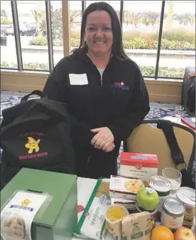  ?? Special to the Herald ?? Tracy Van Raes displays the contents of a typical Starfish Pack, which ensures kids don’t go hungry over the weekend.