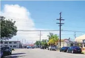  ?? ANDREA LOPEZ-VILLAFAÑA U-T PHOTOS ?? Smoke from the Navy ship fire is seen from 30th Street and Boston Avenue in Barrio Logan.