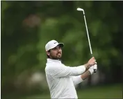  ?? NICK WASS – THE ASSOCIATED PRESS ?? Leader Jason Day watches his shot off the 16th during the second round of the Wells Fargo Championsh­ip on Friday.