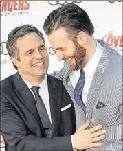  ?? CONTRIBUTE­D BY GETTY IMAGES ?? Mark Ruffalo and Chris Evans, shown at the Hollywood premiere of “Avengers: Age of Ultron,” have been filming the latest “Avengers” installmen­t in Atlanta.