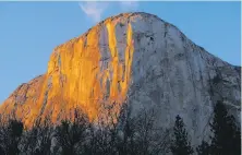  ?? Tom Stienstra / The Chronicle ?? Dusk's alpenglow on El Capitan in Yosemite National Park.
