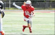  ?? NEWS-HERALD FILE ?? Mentor’s Luke Floriea seeks to evade a tackler during a game last season.