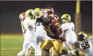  ?? Matthew Brown / Hearst Conn. Media file photo ?? Hand QB Phoenix Billings hit on his pass by St. Joseph Jermaine Williams in the fourth quarter of the CIAC Class L state championsh­ip football game on Dec. 14.