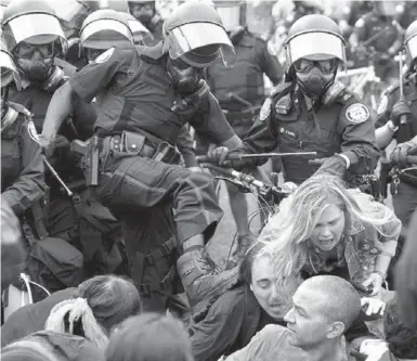  ?? RICHARD LAUTENS/TORONTO STAR FILE PHOTO ?? The handling — and manhandlin­g — of protesters at the G20 summit in 2010 changed the city’s perception of Blair.