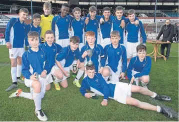  ??  ?? St John’s HS celebrate with the Urquhart Trophy after beating Monifieth in the final at Dens Park. Tonight at Jeanfield Swifts ground, they face Queen Anne High (Dunfermlin­e) in an U/14 Inspirespo­rt Sport Shield semi-final.