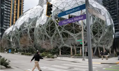  ??  ?? The Amazon headquarte­rs sits virtually empty on Tuesday. Photograph: John Moore/Getty Images